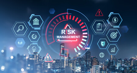 Risk management concept hologram with icons on cityscape background at night.