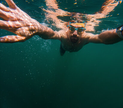 Man practicing underwater swimming