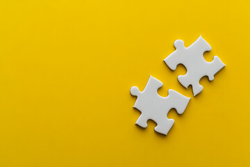 White jigsaw puzzle isolated on a yellow background