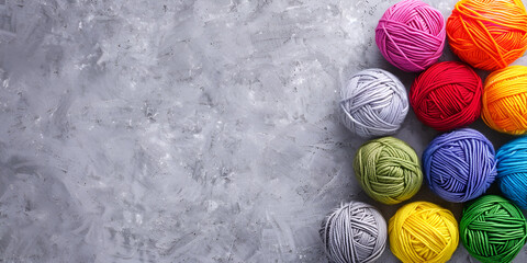  close-up of several colorful balls on a gray background. The balls are arranged in a row and are colored red, blue, green, yellow, and orange.