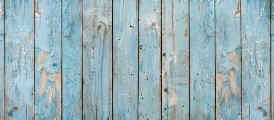 Fototapeta premium Vintage light blue wood with a weathered appearance provides a beautiful backdrop with a wooden texture ideal for a copy space image