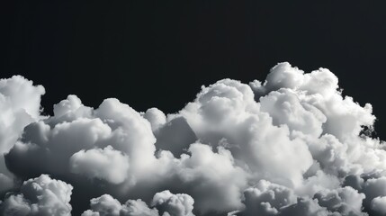 White clouds on black background. Black and white clouds in the sky isolated on dark background. Cloud texture and pattern for design, banner or wallpaper.