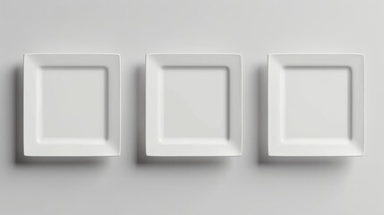 Three minimalist white square plates create a contemporary and stylish wall decor.