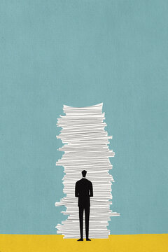 Businessman standing near stack of document papers against teal colored background