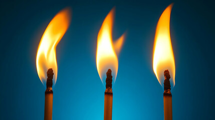 Three Burning Matches with Blue Background