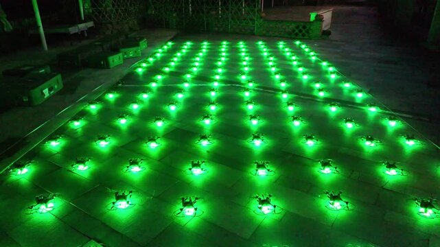 illuminated drones on floor