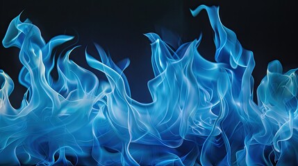 Fototapeta premium The mesmerizing Blue flames danced gracefully against the pitch black backdrop