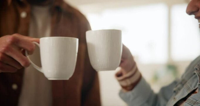 Morning, tea and couple toast in home kitchen with conversation, cup and mug with drink. Relax, communication and love of people with cheers, house and marriage talking for breakfast plan with coffee