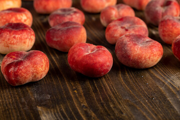 a pile of ripe washed peaches on the table