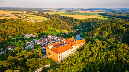 the castle of Bechyně Manor in South Bohemia on the banks of the river Lužnice. The castle is photographed from a drone from above, aerial view.