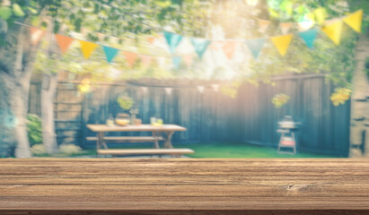 Obraz premium summer time party in backyard garden with grill BBQ, wooden table, blurred background