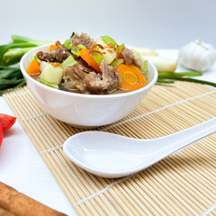 BeBeef soup, with carrots, potatoes and tomatoesef soup, with carrots, potatoes and tomatoes.