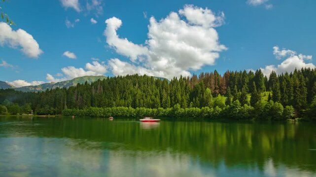 Time Lapse 4k video of Karagol Lake in Savsat district of Artvin with motion of the clouds and boats. Visit Turkey concept video.