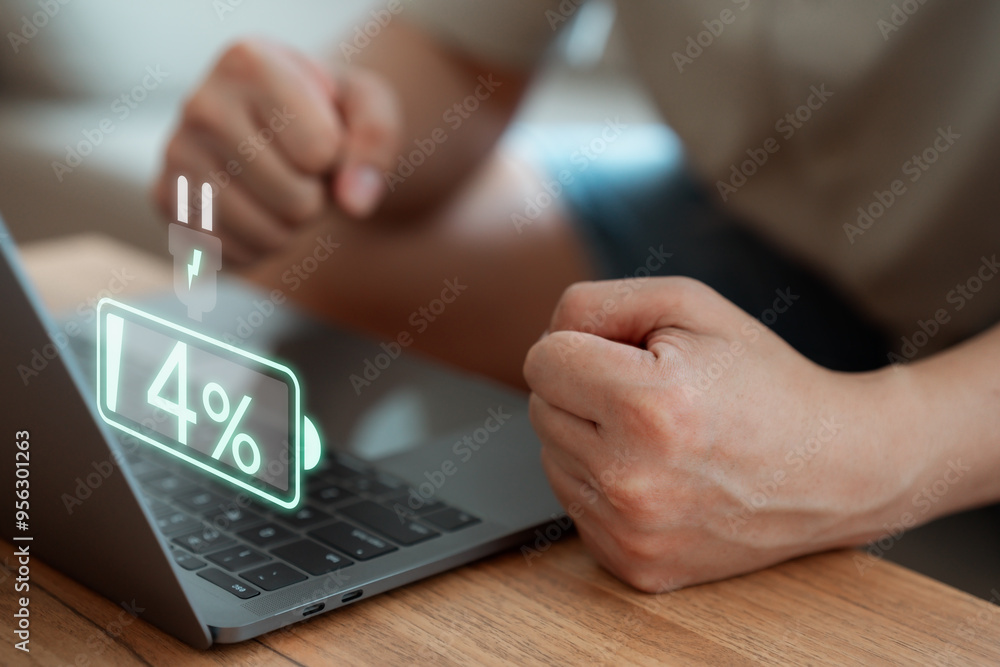 Aufkleber laptop out of battery. concept of technology and daily life. man is angry and frustrated when he lea