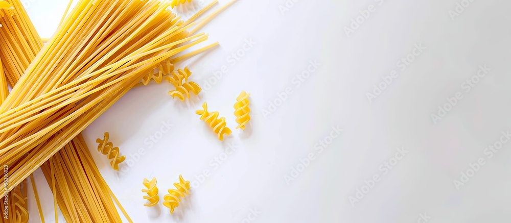 Aufkleber Top view of uncooked spaghetti on a white backdrop with space for adding images known as a copy space image