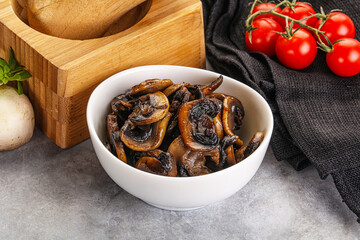 Roasted champignon mushrooms in the bowl