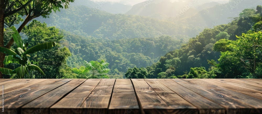 Poster Wooden table with a blurred backdrop of mountains and lush greenery providing a copy space image for displaying products against a stunning forest landscape