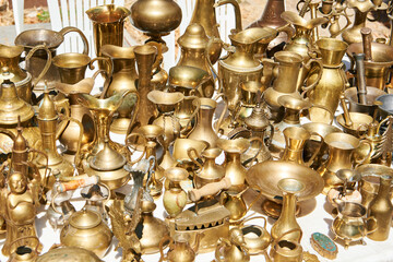 Antique brass and bronze utensils at flea market