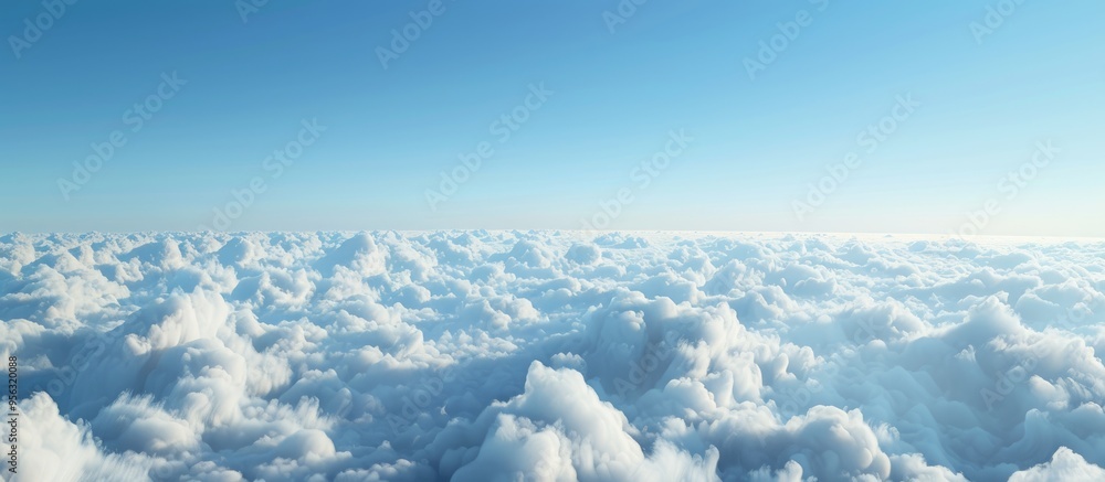 Poster Scenic aerial view with serene white clouds against a clear blue sky visible through a plane window offering a tranquil copy space image