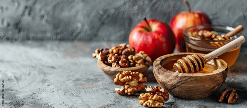 Poster Sweet honey bowls with walnuts and apples displayed on a grey backdrop with copy space image