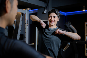 Instructor men teaching stretching, dance and aerobics at gyms and other places and their customers.