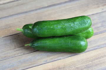 cucumber on a wooden board
