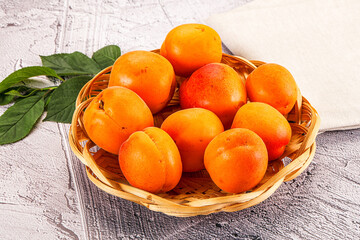 Raw ripe sweet apricots heap