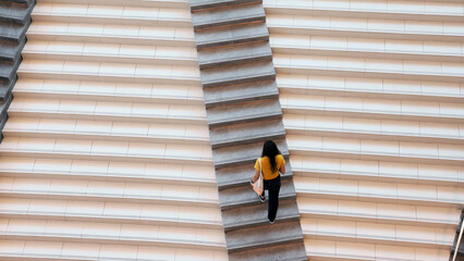 Top high wide angle view Go green Gen Z woman asia young people eco tote bag reuse step walk up down stairs city life save the earth world care. Reduce issues asian hope net zero waste the way forward © ChayTee