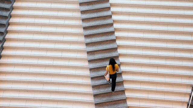 Top high wide angle view Go green Gen Z woman asia young people eco tote bag reuse step walk up down stairs city life save the earth world care. Reduce issues asian hope net zero waste the way forward