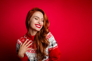 Photo portrait of toothy beaming smile young lady wear ugly ornament sweater winter season shopaholic isolated on red color background