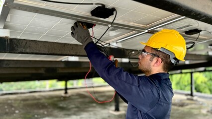 Technical engineer Inspecting the installation of the solar panels and checking the integrity of...