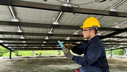 Technical engineer Inspecting the installation of the solar panels and checking the integrity of...