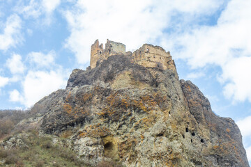 Medieval fortress of Drissi on a rock. Stone walls with loopholes and a tower.