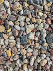 Texture background of small stones close-up, crushed stone, pebbles. High quality photo