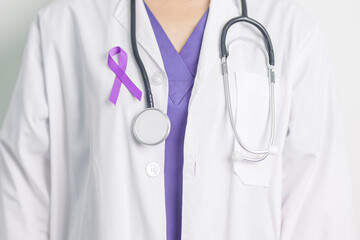 Doctor holding purple Ribbon for Violence, Pancreatic, Esophageal, Testicular cancer, Alzheimer,...