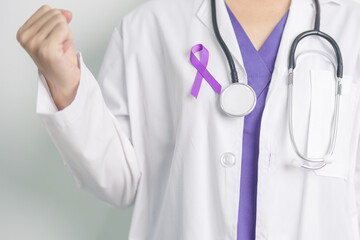 Doctor holding purple Ribbon for Violence, Pancreatic, Esophageal, Testicular cancer, Alzheimer,...
