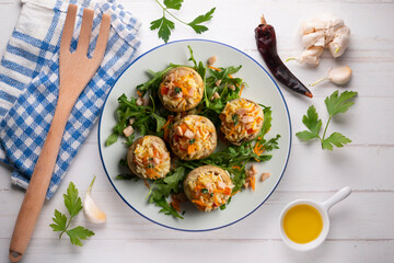 Mushrooms stuffed with rice and vegetables. Top view table.