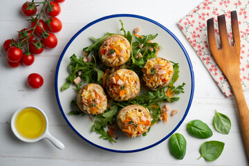 Mushrooms stuffed with rice and vegetables. Top view table.
