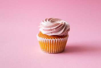 Cupcake on pink background. Dessert. Cooking. Baking. Vegetarian food.