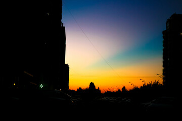 Colorful tones of sunset. Dusk, Evening Sky Clouds on Twilight over Sea, Dramatic horizon Orange blue Sunset Blue Sky Background in the city