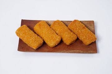 American Risoles or risoles mayo is a traditional Indonesian snack filled with smoked beef or sausage, boiled eggs & mayonnaise. Crispy texture on the outside. Risoles on wood plate isolated white.