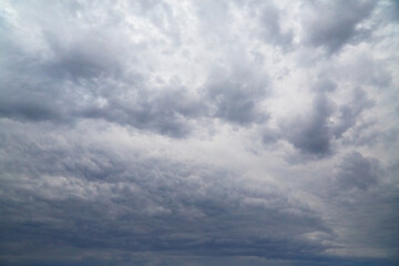 .Sky completely covered by gray-blue clouds
