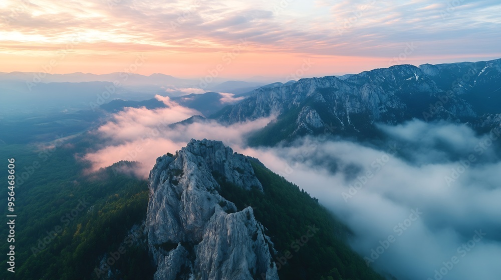 Poster aerial view of mountains in low clouds at sunrise in summer slovenia view from above of mountain pea