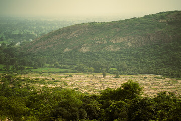 Aerial View of a Vast Landscape, Panoramic View of a Distant Valley, Scenic Landscape at Sunset Time, Misty Mountains and Rolling Hills Stock Photo.