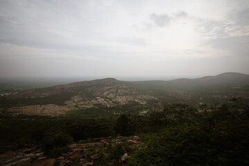 Aerial View of a Vast Landscape, Panoramic View of a Distant Valley, Scenic Landscape at Sunset Time, Misty Mountains and Rolling Hills Stock Photo.