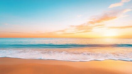 Obraz premium a serene beach at sunset with gentle waves lapping at the shore, the sky painted in warm hues of orange and pink, evoking a sense of calm and tranquility