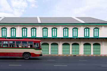 Bangkok's red and cream buses and the subway station building