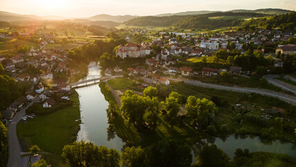 Zuzemberk Castle and medieval village on the river Krka in Slovenia. Aerial drone view