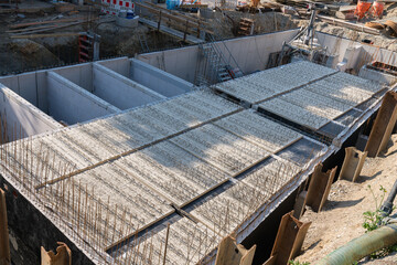 Aerial view of a construction site with the start of foundation work