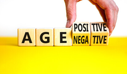 Age positivity or negativity symbol. Concept word Age positivity or Age negativity. Beautiful white background. Psychologist hand. Psychological age positivity or negativity concept. Copy space.